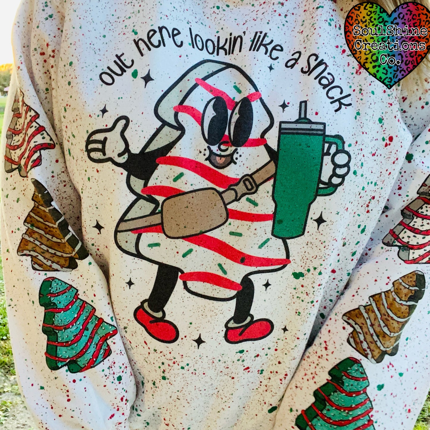 Out here lookin’ like a Snack Splatter Christmas Sweater
