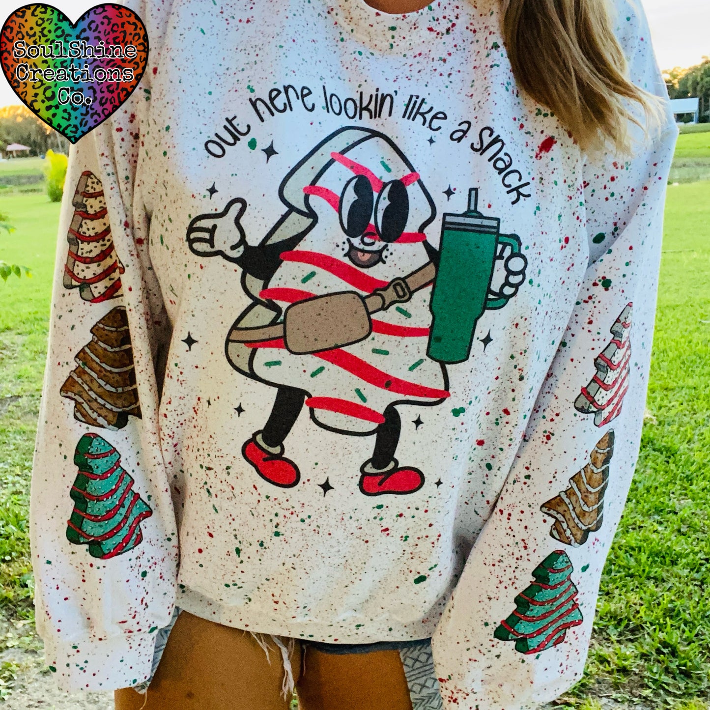 Out here lookin’ like a Snack Splatter Christmas Sweater